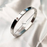 Stainless Steel Zircon And Cross Nut Bangle - 7 Options